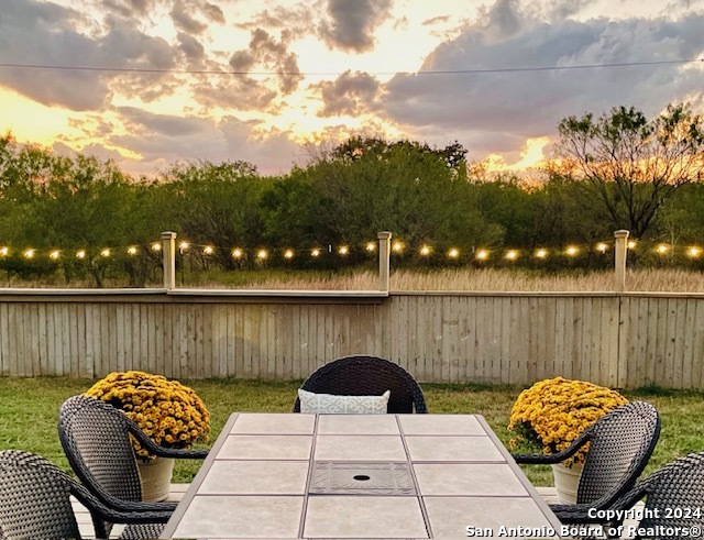 a view of a chairs and table in the patio