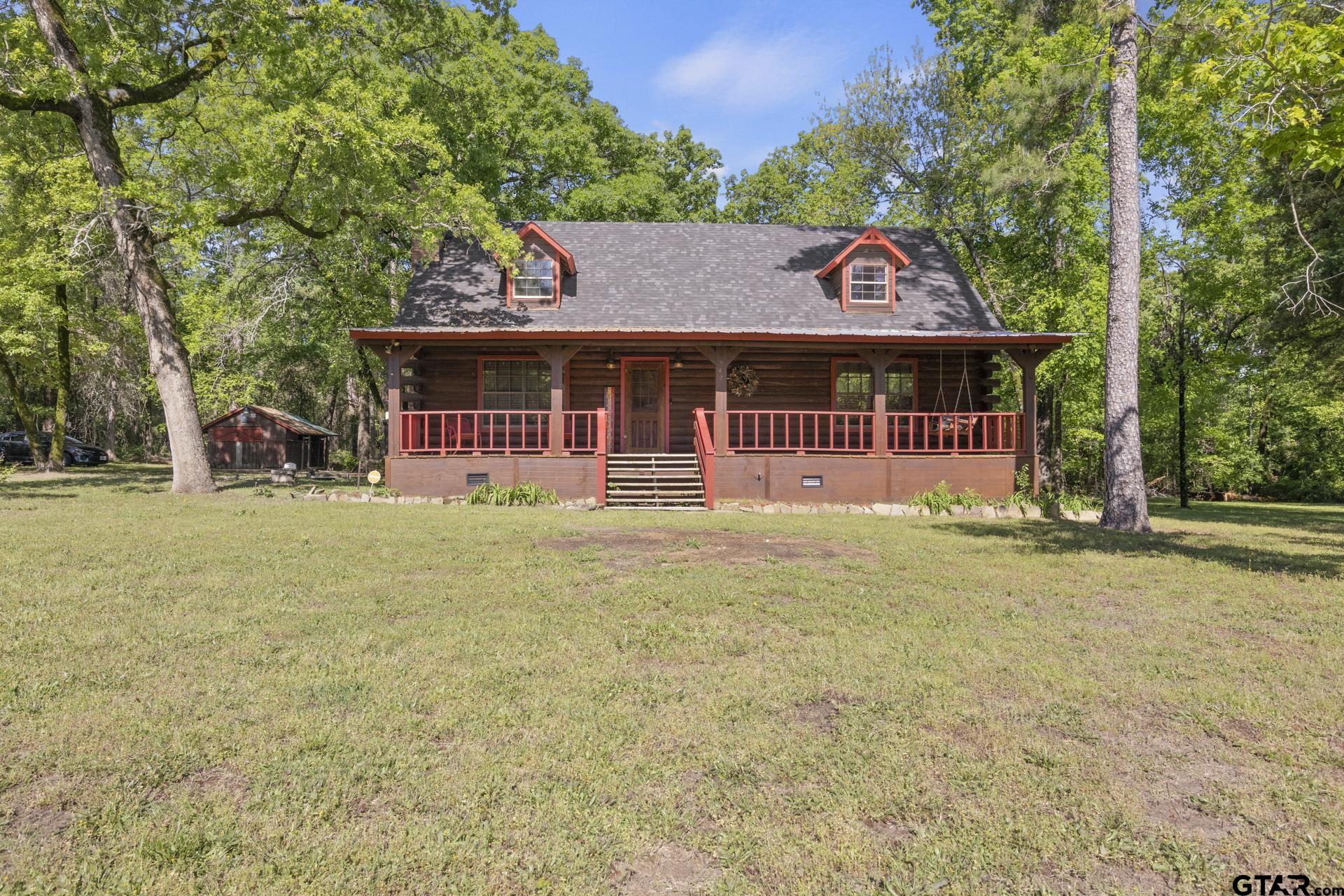 front view of a house with a big yard