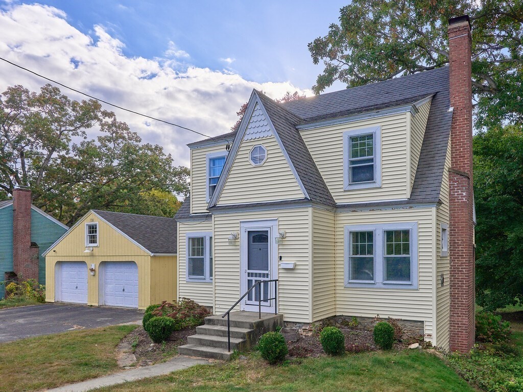 a front view of a house with a yard