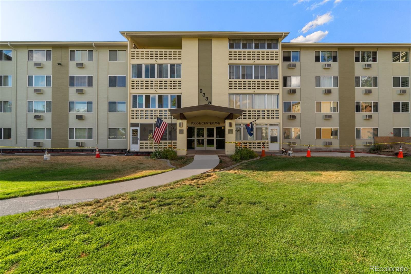 a front view of building with yard