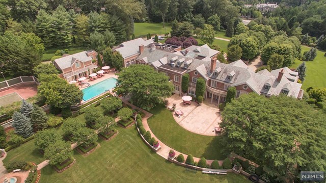 an aerial view of a house with outdoor space