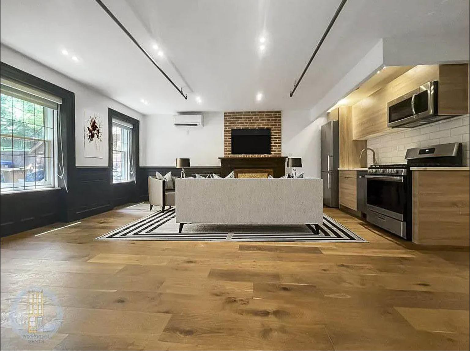 a view of kitchen with furniture and flat screen tv