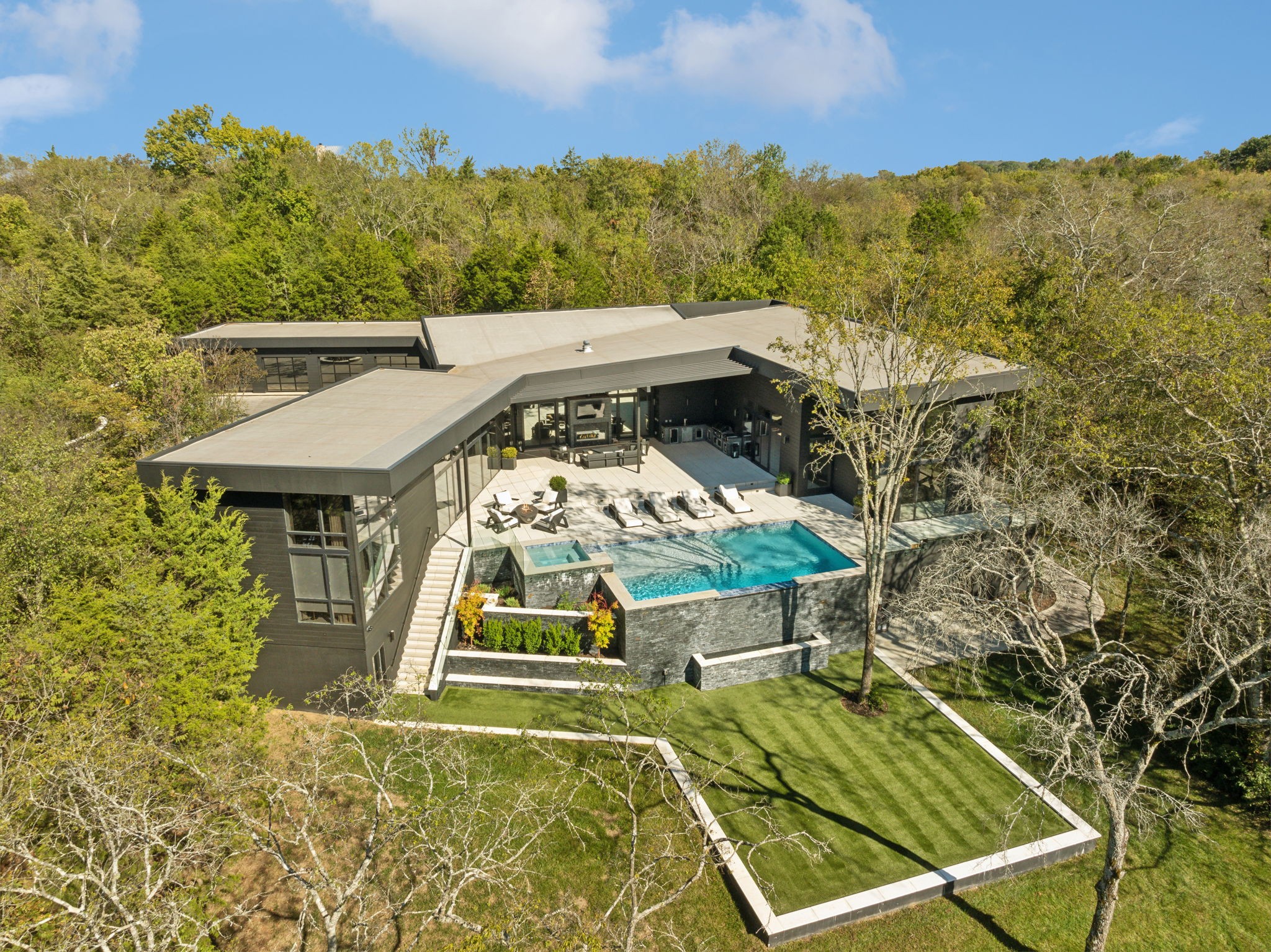 aerial view of a house with a yard