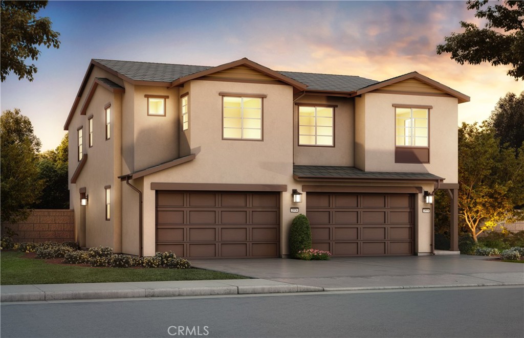 a front view of a house with garage