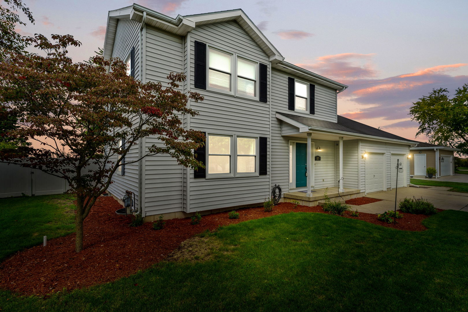 front view of a house with a yard