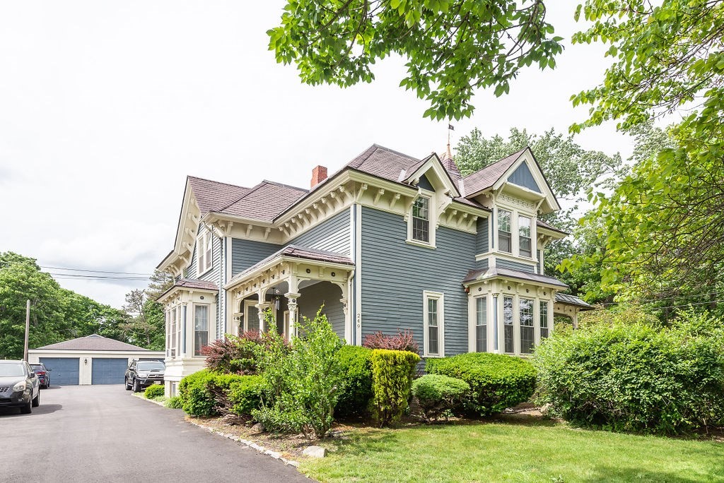 a front view of a house with a garden