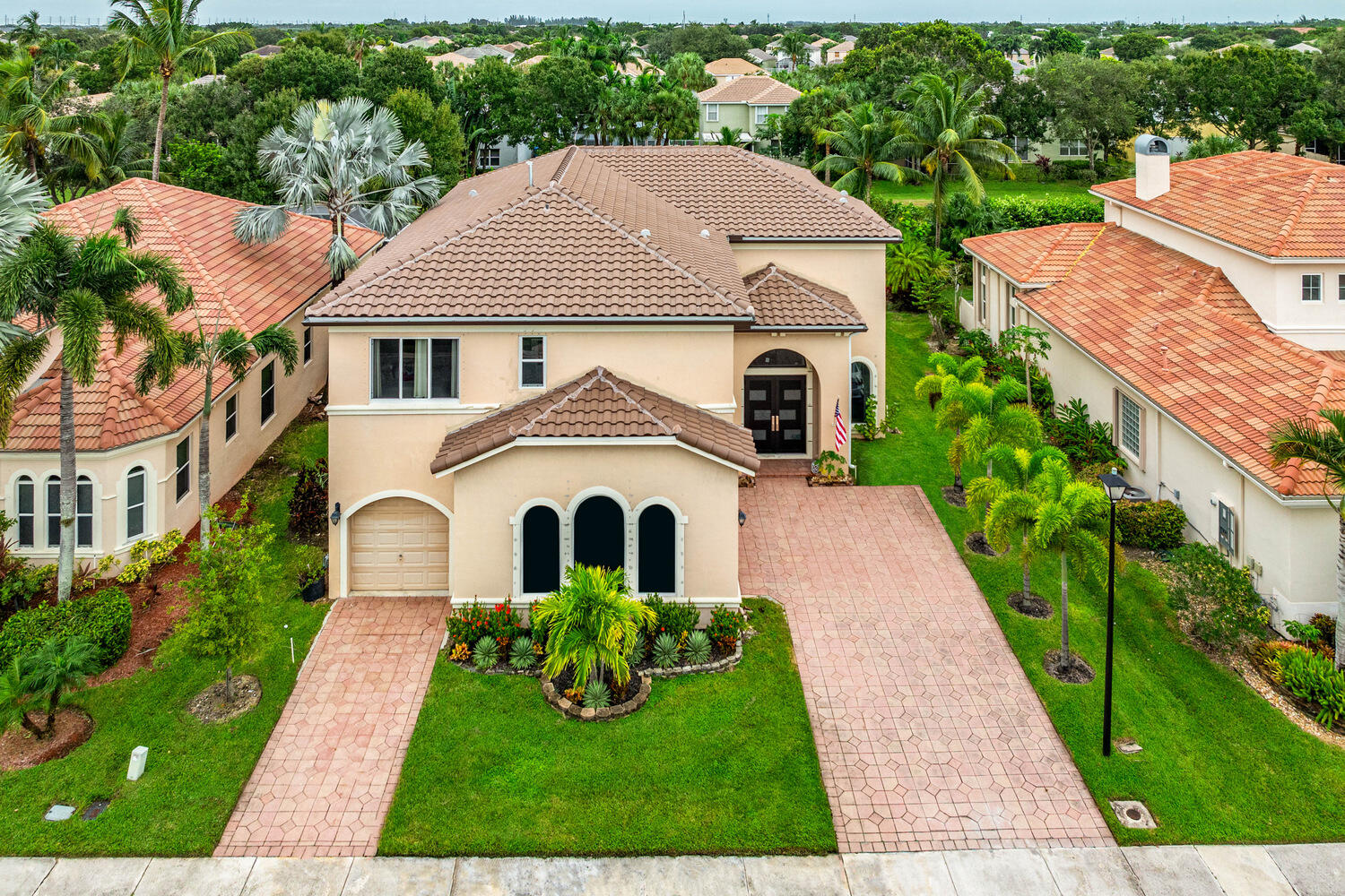 a aerial view of a house with a yard