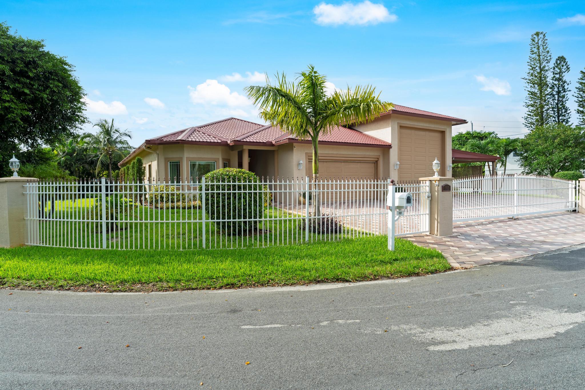 a view of a house with a small yard and plants