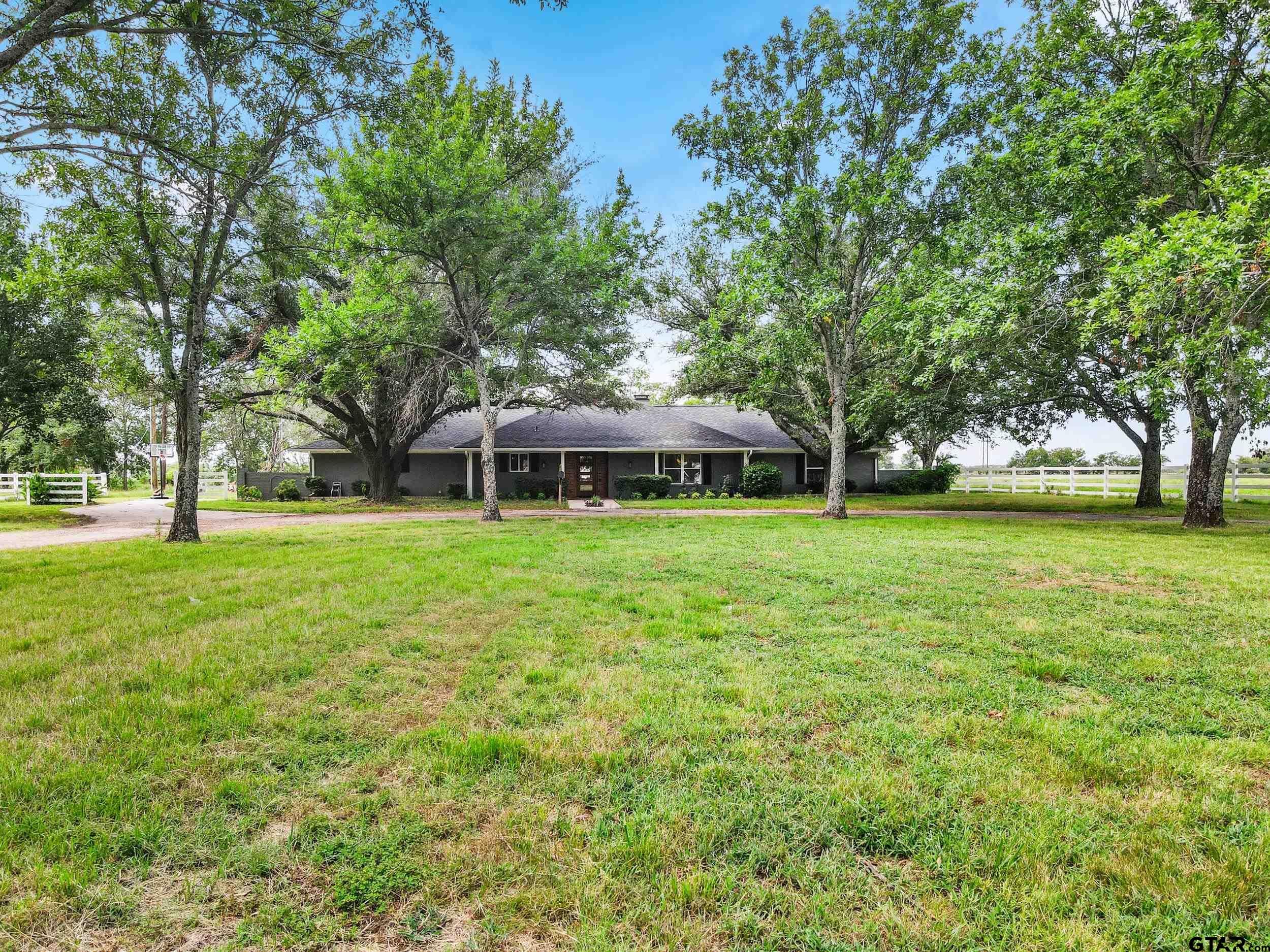 a view of a house with a big yard