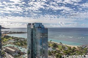 a view of ocean with a multi story building