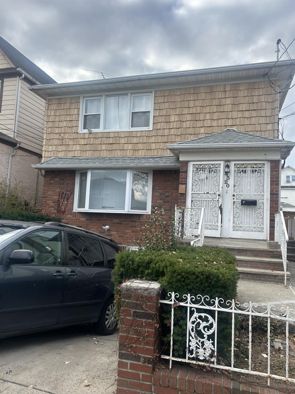 a front view of a house with parking