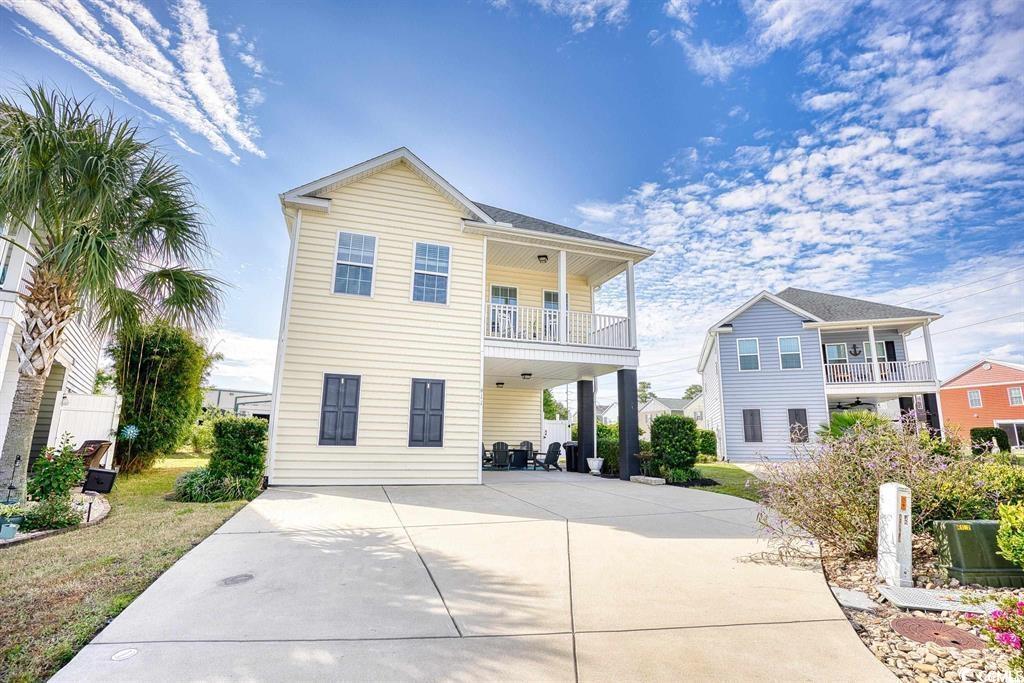 View of front of property featuring a balcony