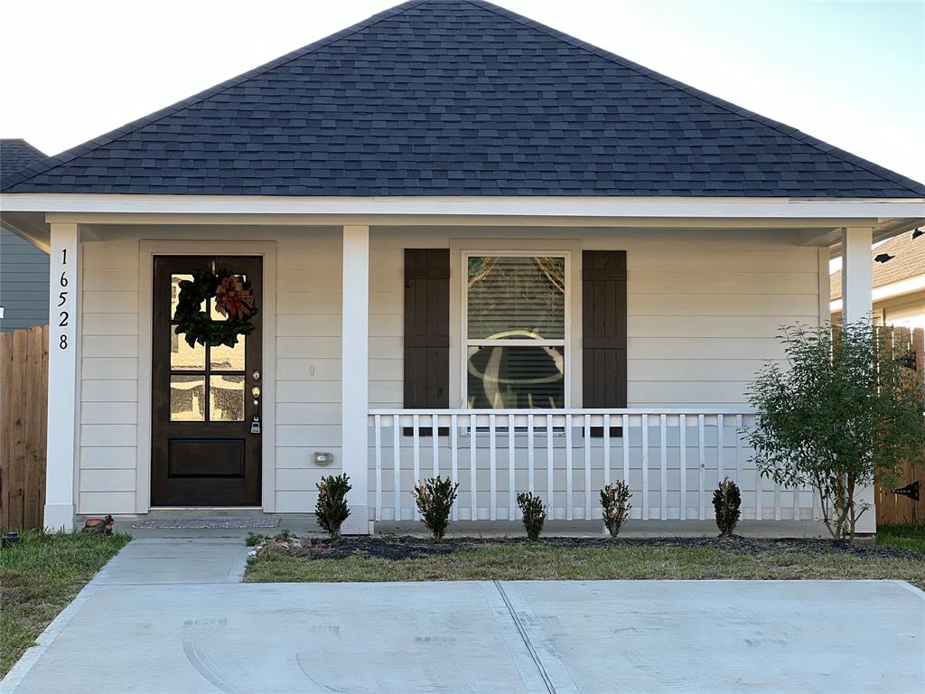 Inviting Front Porch with Elegant Custom Door