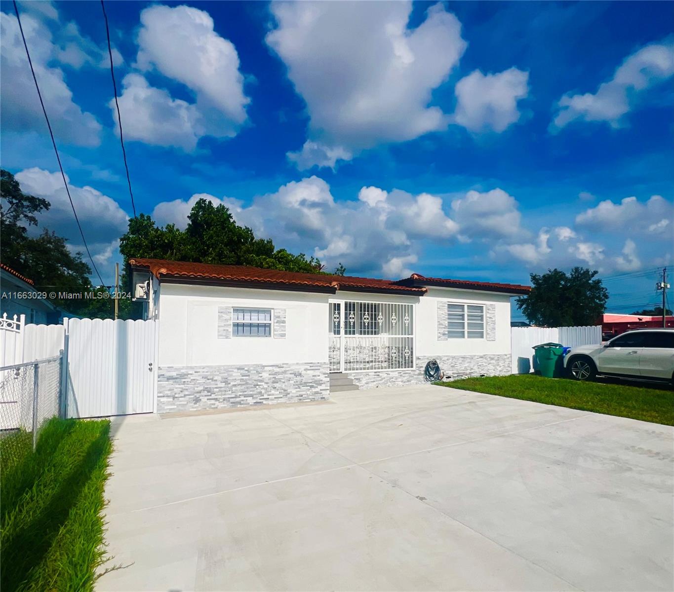 a view of a house with a yard and garage