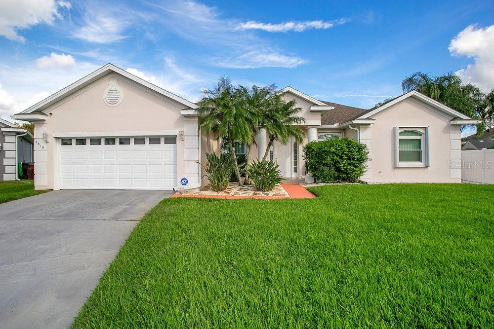 a view of a house with a yard