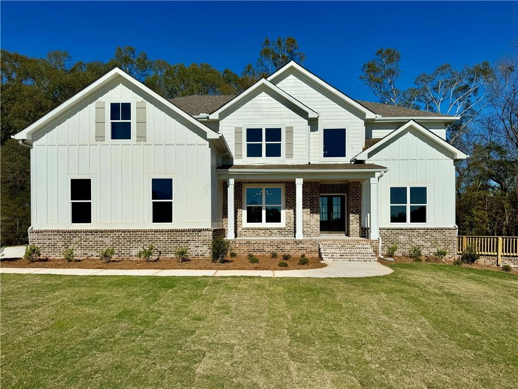 a front view of a house with a yard