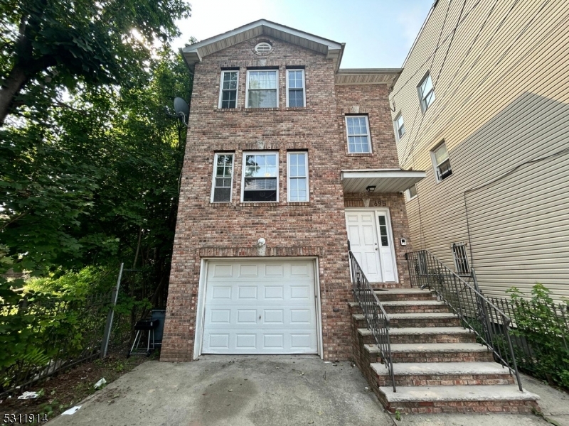 a front view of a house with a garage