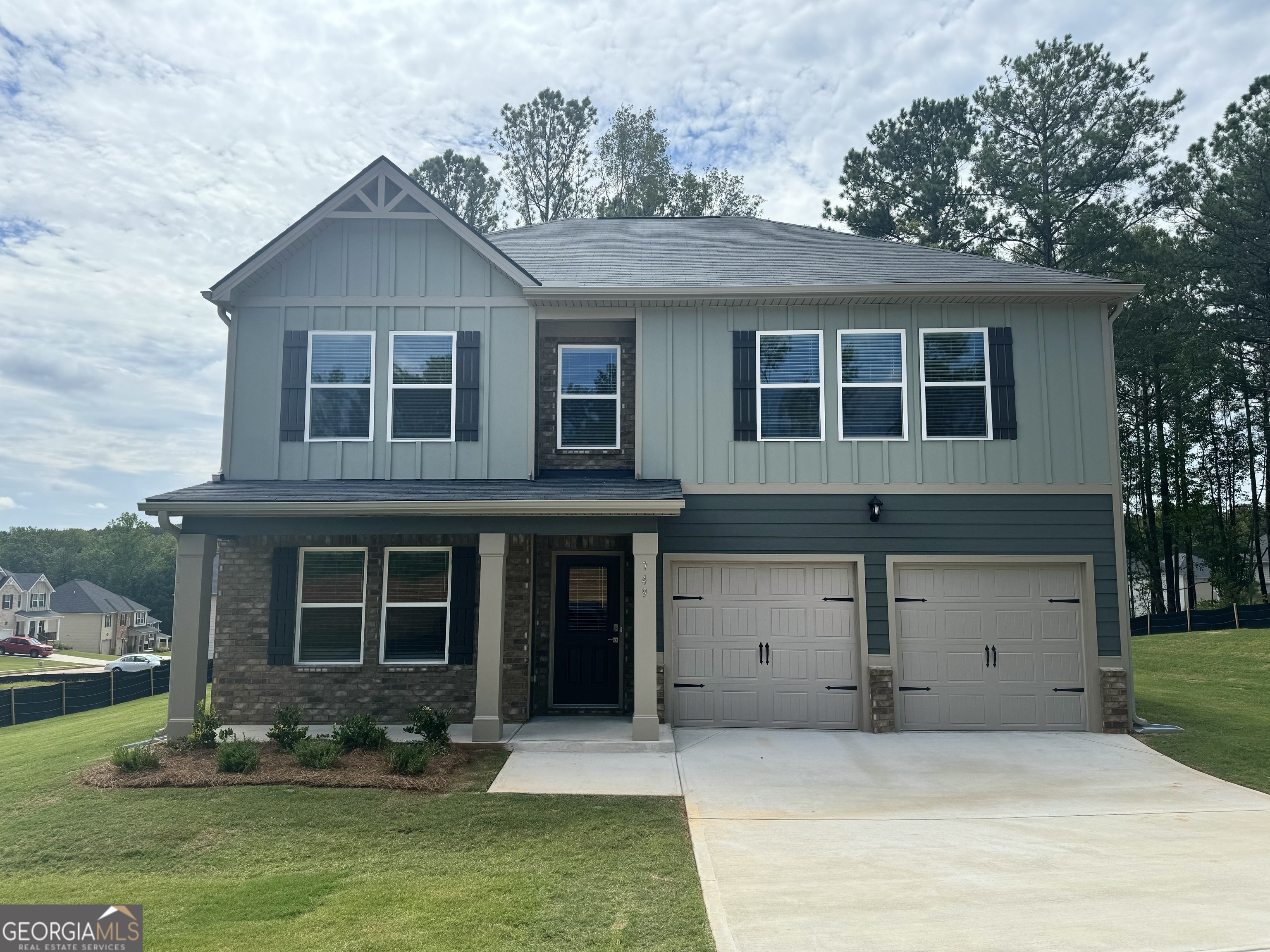 front view of a house with a yard