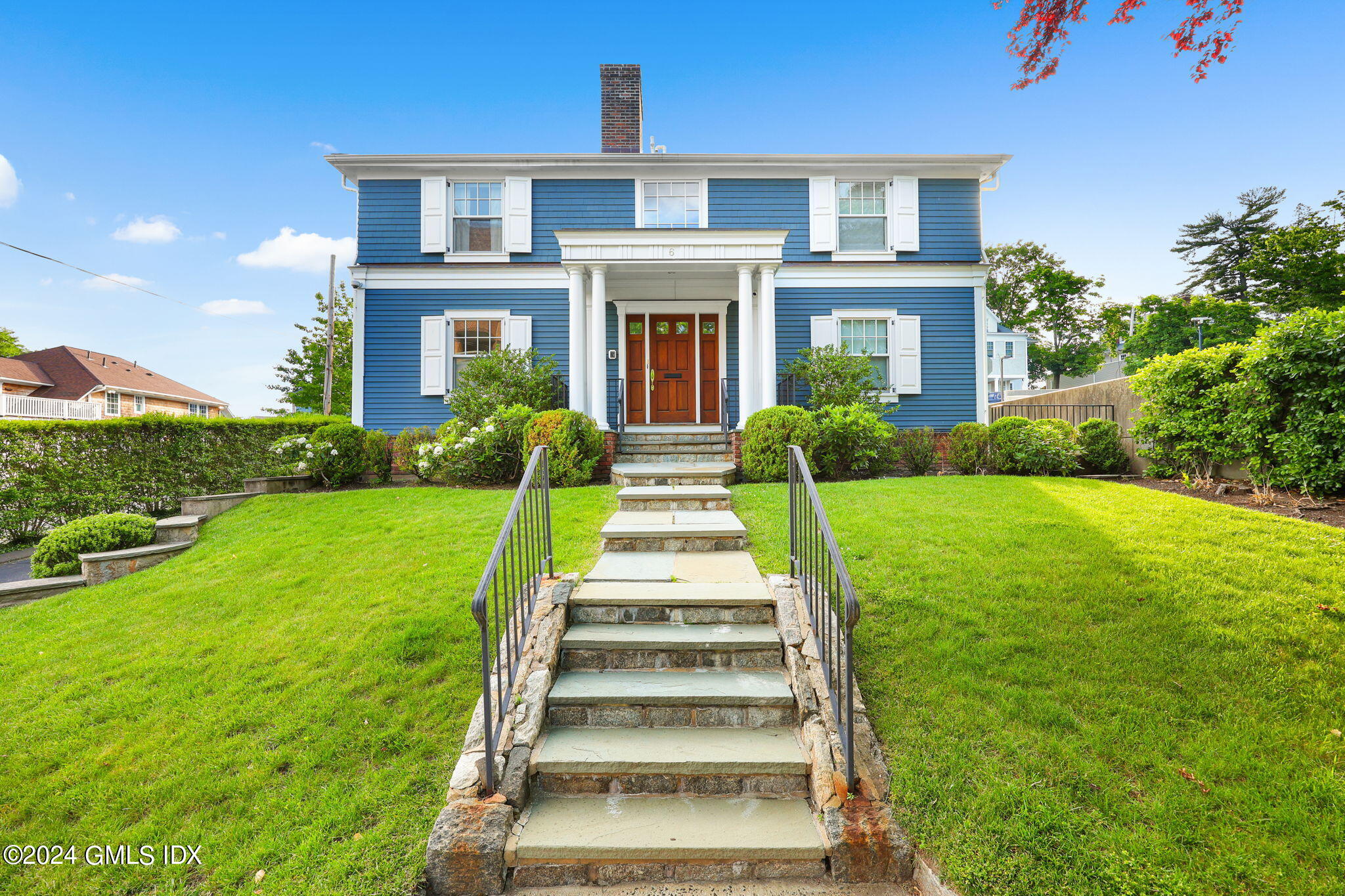 a front view of a house with a yard