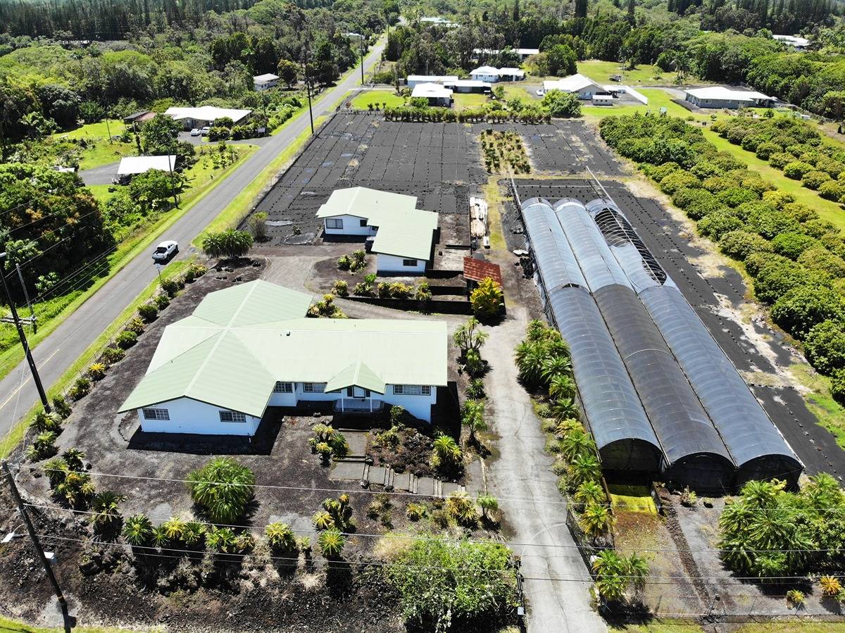 an aerial view of a house with a garden