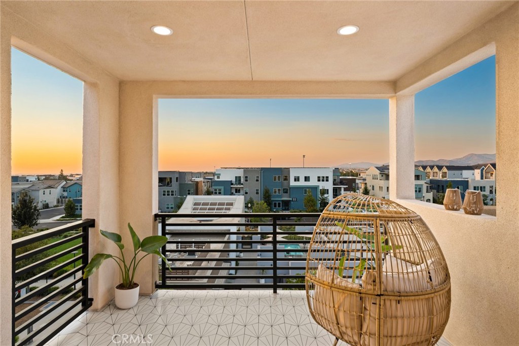 a view of a living room and a balcony