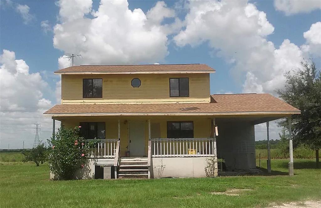 front view of house with a yard