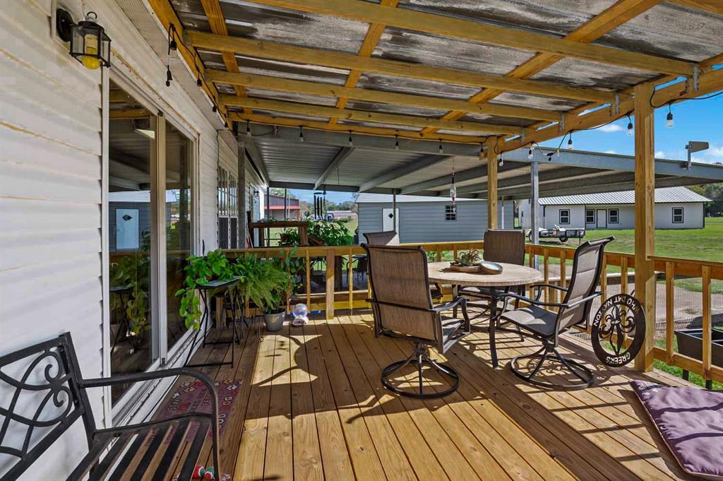 a view of a chairs and table in the patio