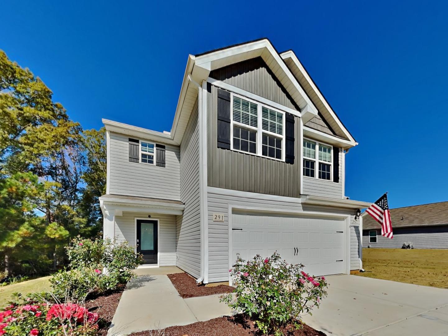 a front view of a house with a yard