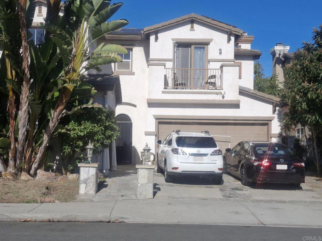 a front view of a house with garage