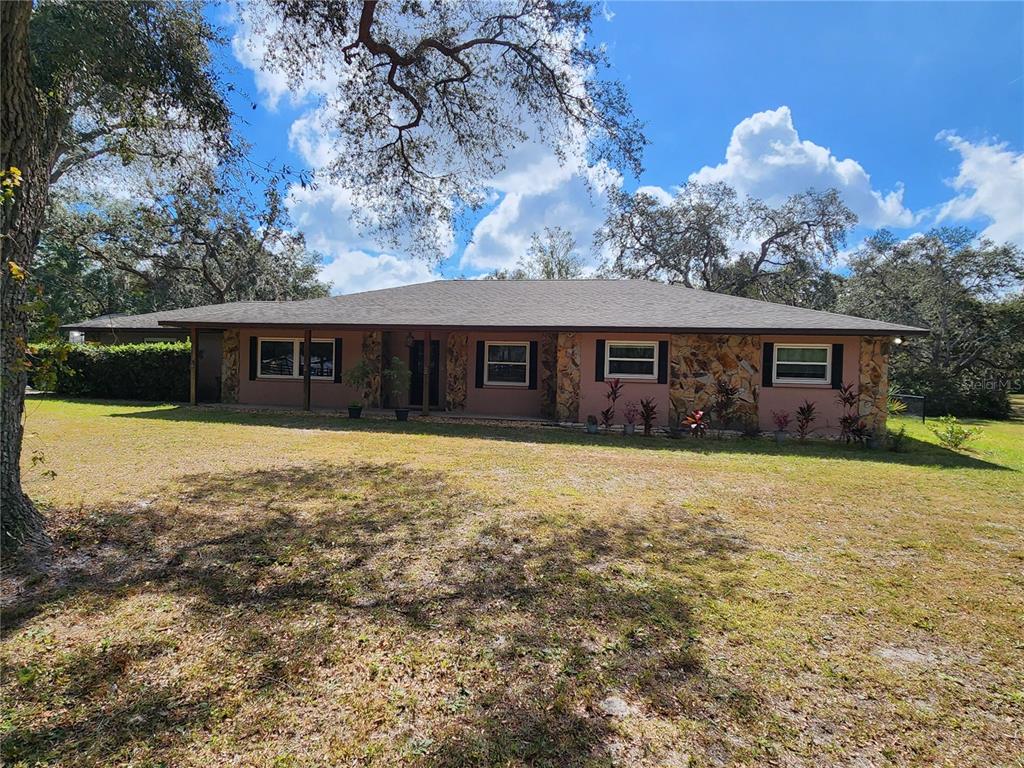 front view of a house with a yard