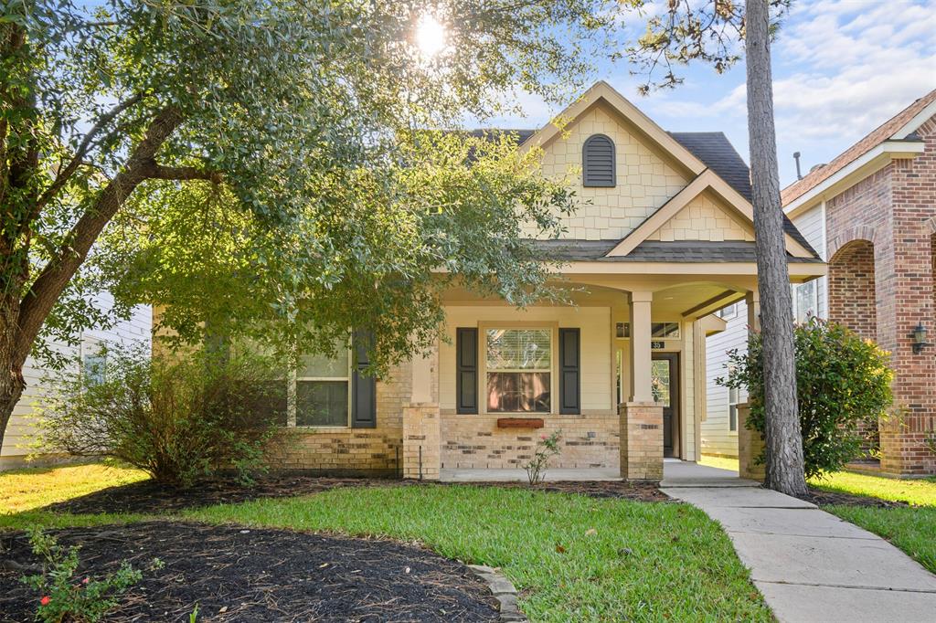 a front view of a house with a yard and porch