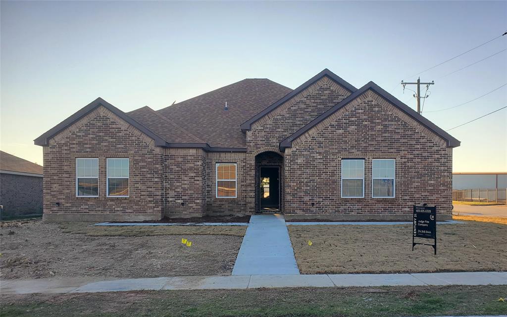 a front view of a house with yard