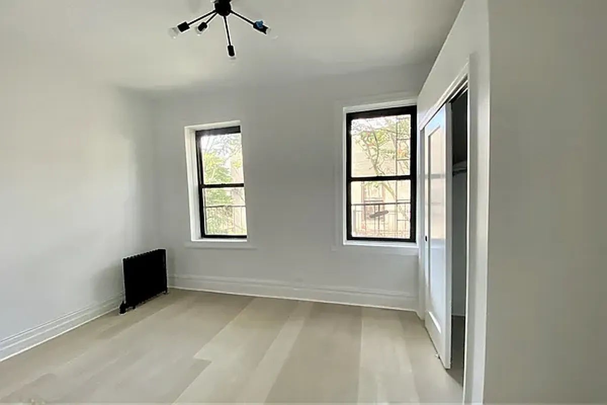 a view of an empty room with a window