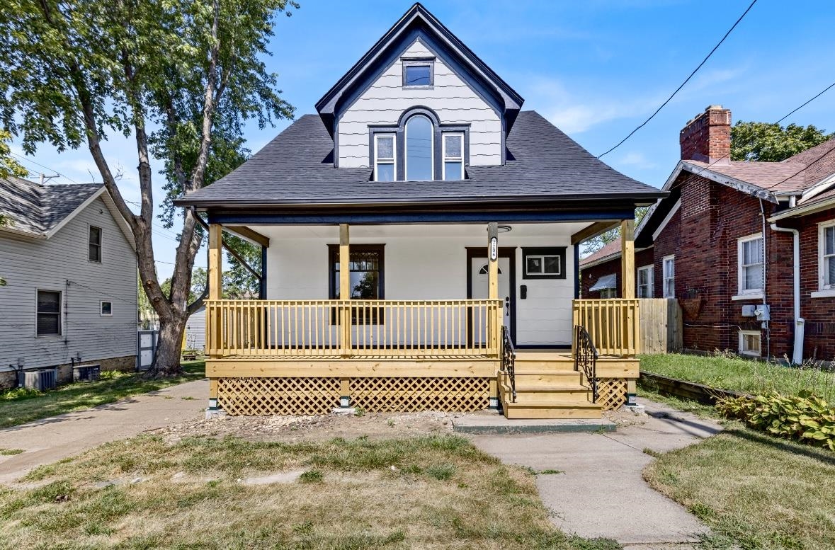 a front view of a house with a small yard