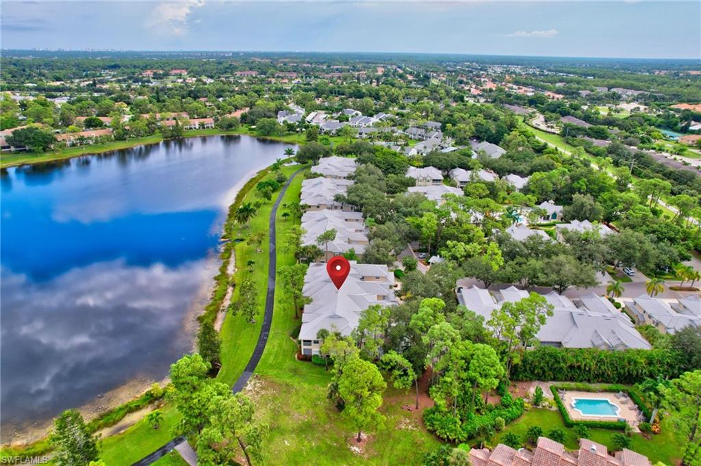 an aerial view of a house with a lake view