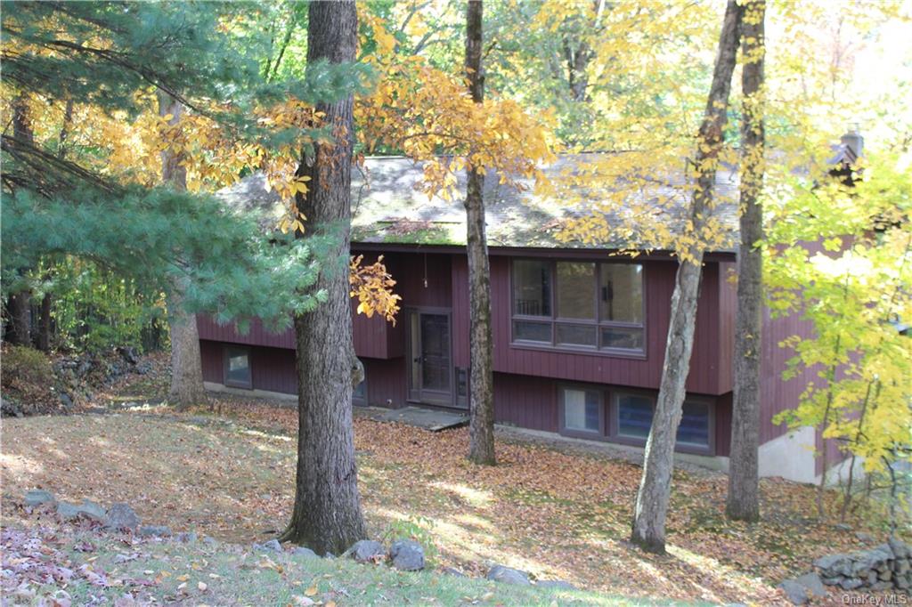 a view of a house with a tree