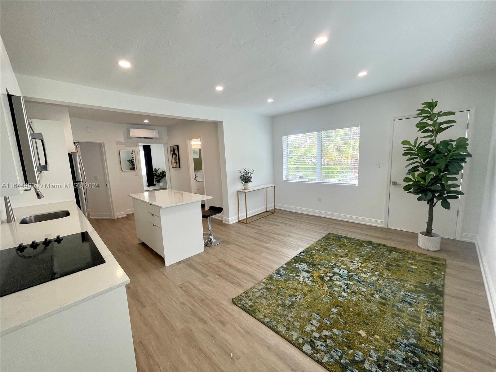 a view of a living room and hardwood floor