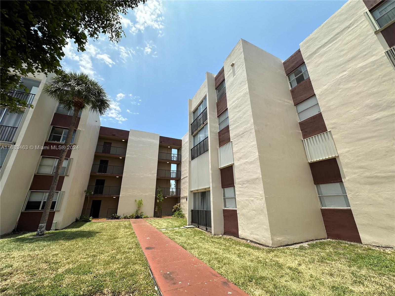 a view of a tall brick building