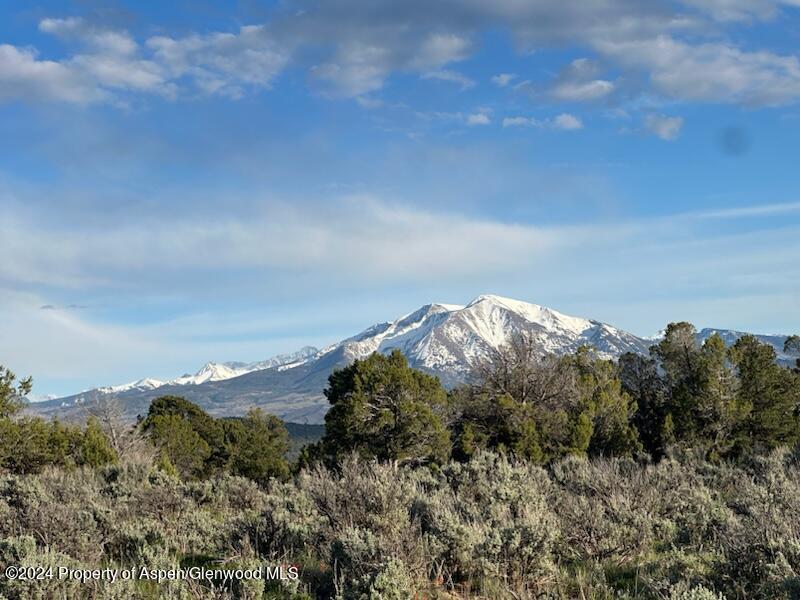 a view of mountains and valleys