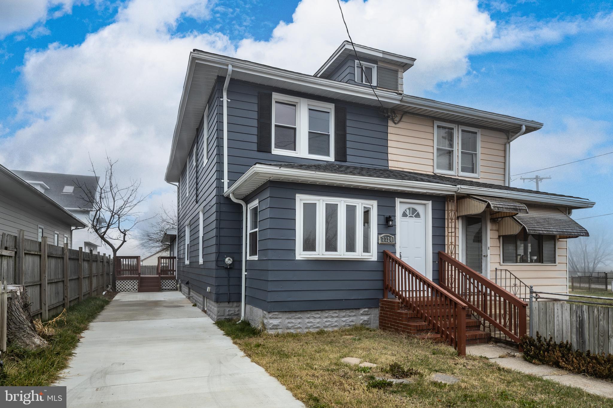 a front view of a house with garage