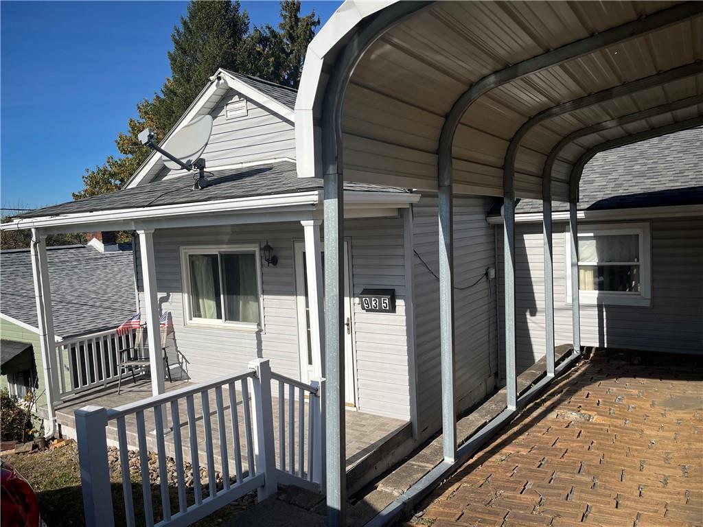 a view of a house with porch and wooden floor