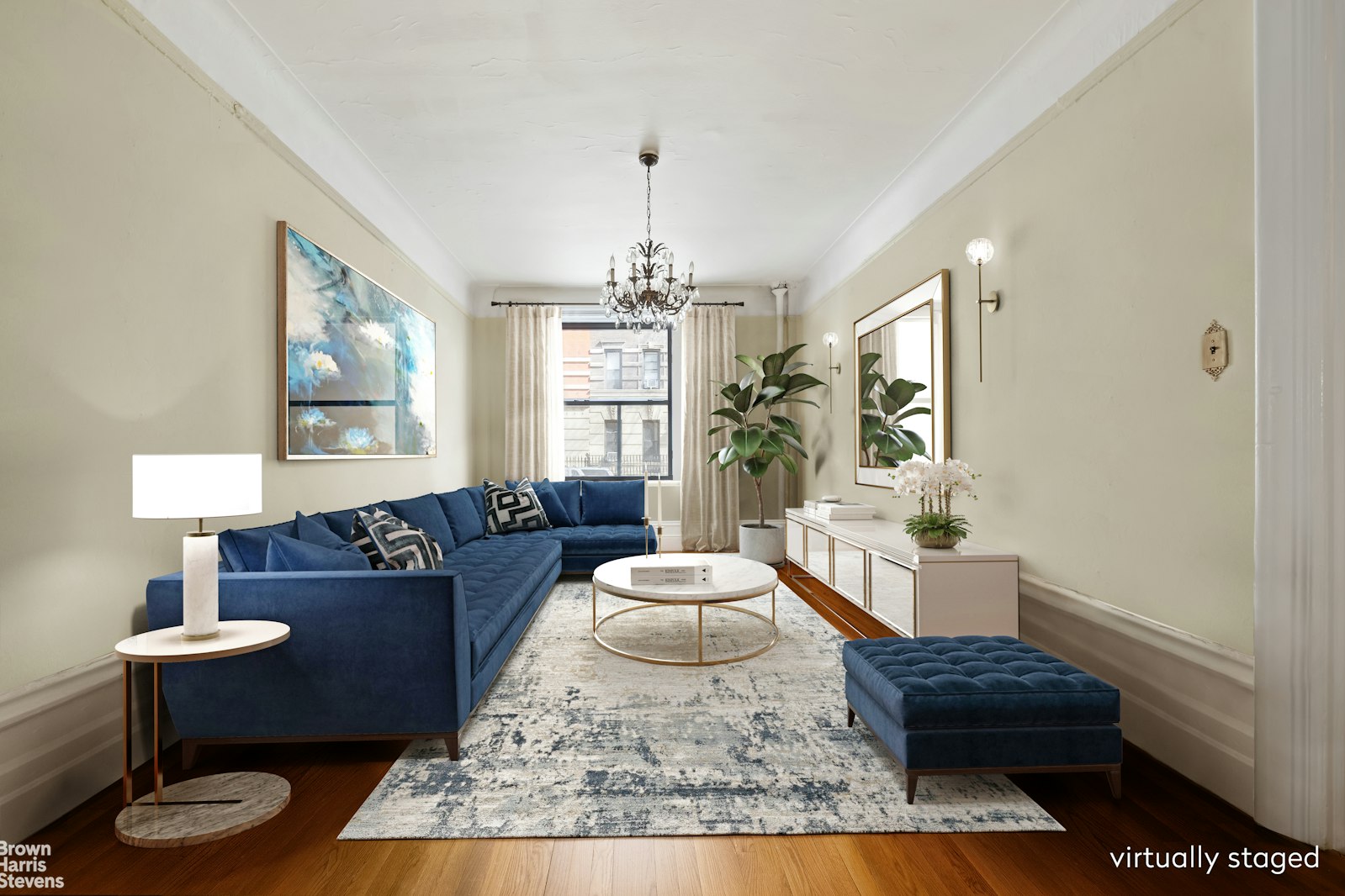 a living room with furniture and a chandelier