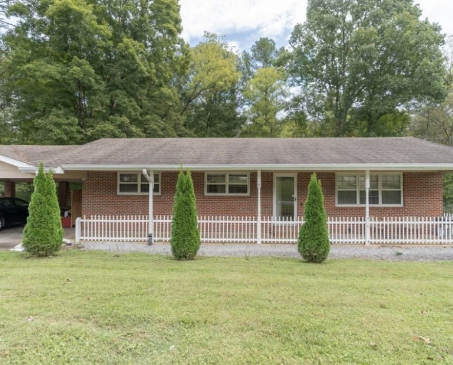 front view of a house with a garden