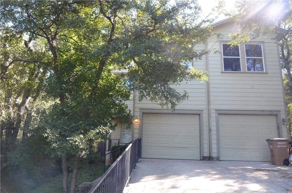 a view of a house with a tree