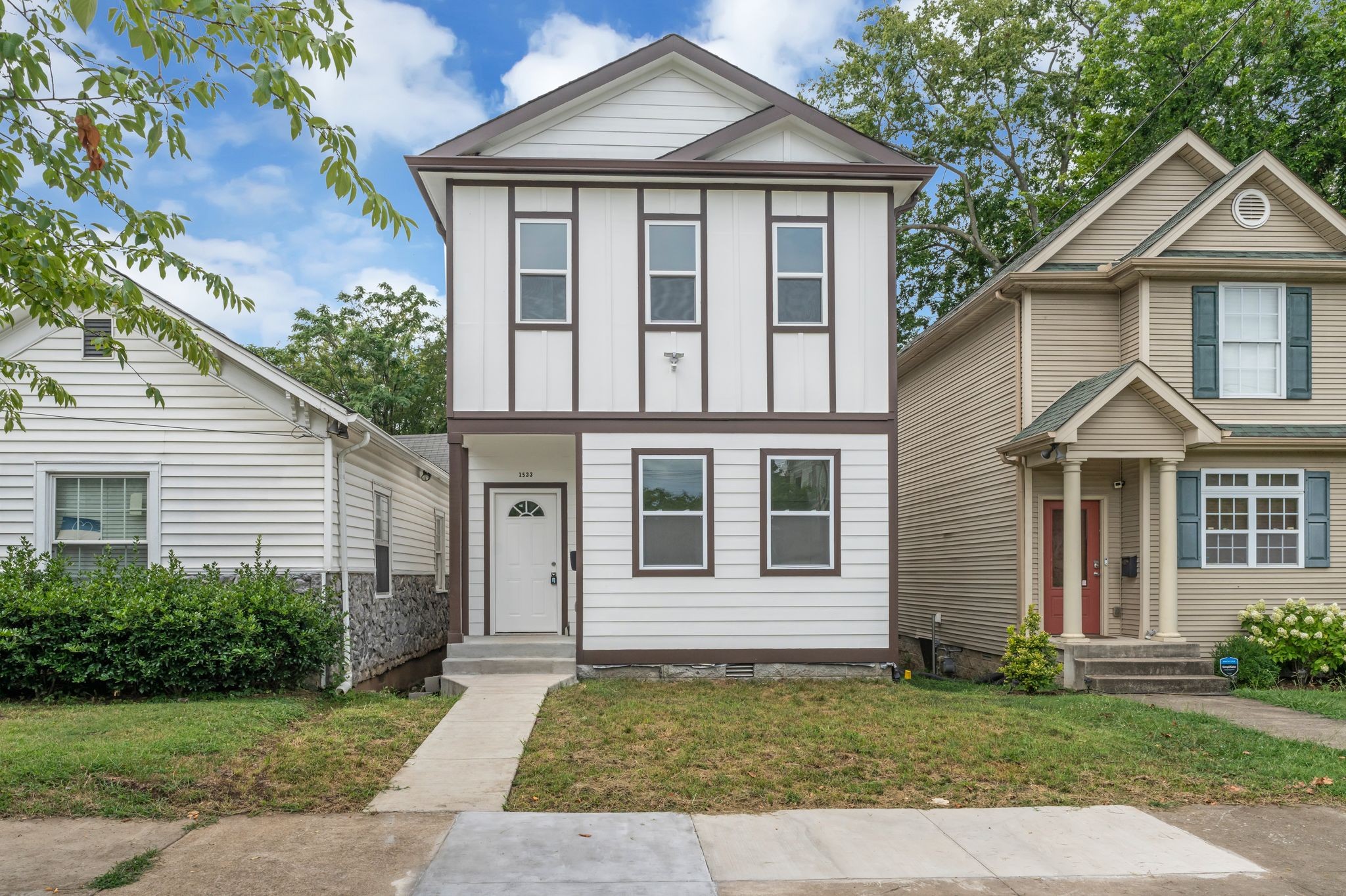 a front view of a house with a yard