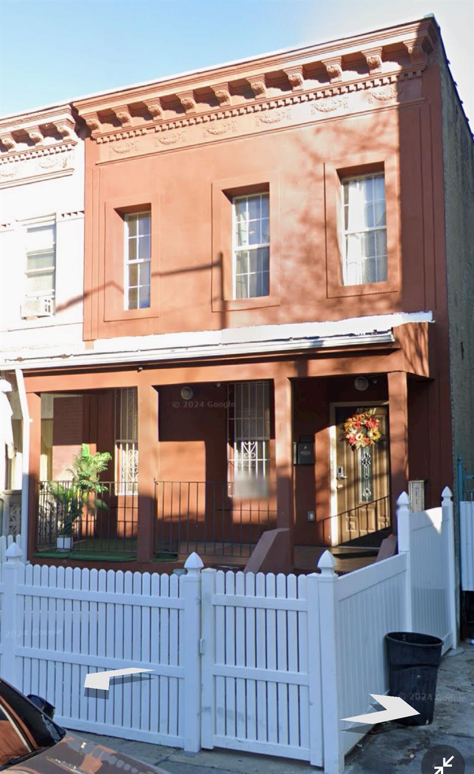 a front view of a house with glass windows