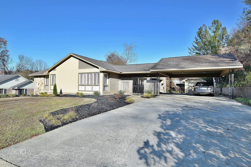 a view of a house with large space and a yard