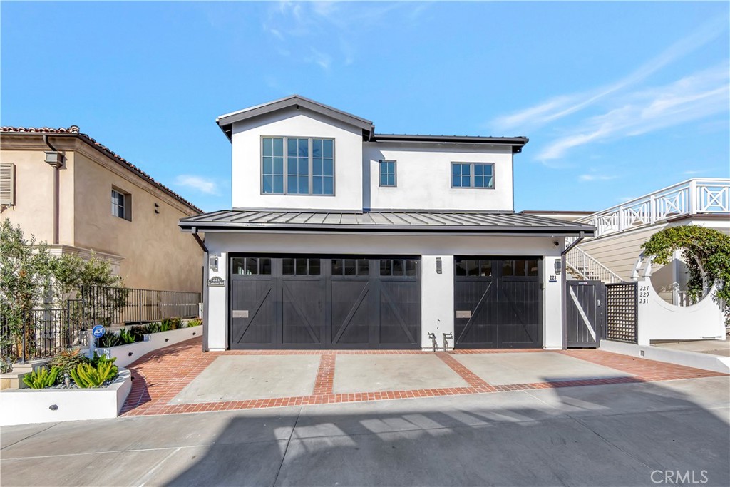 a front view of a house with a garage and a garage