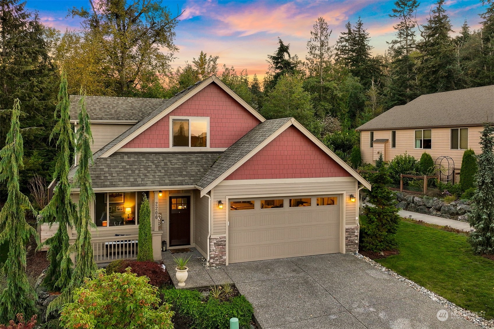 a front view of a house with garden