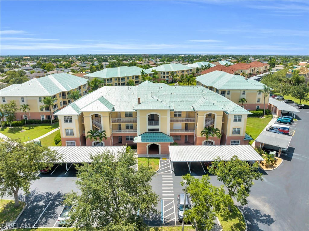 an aerial view of a house with a big yard